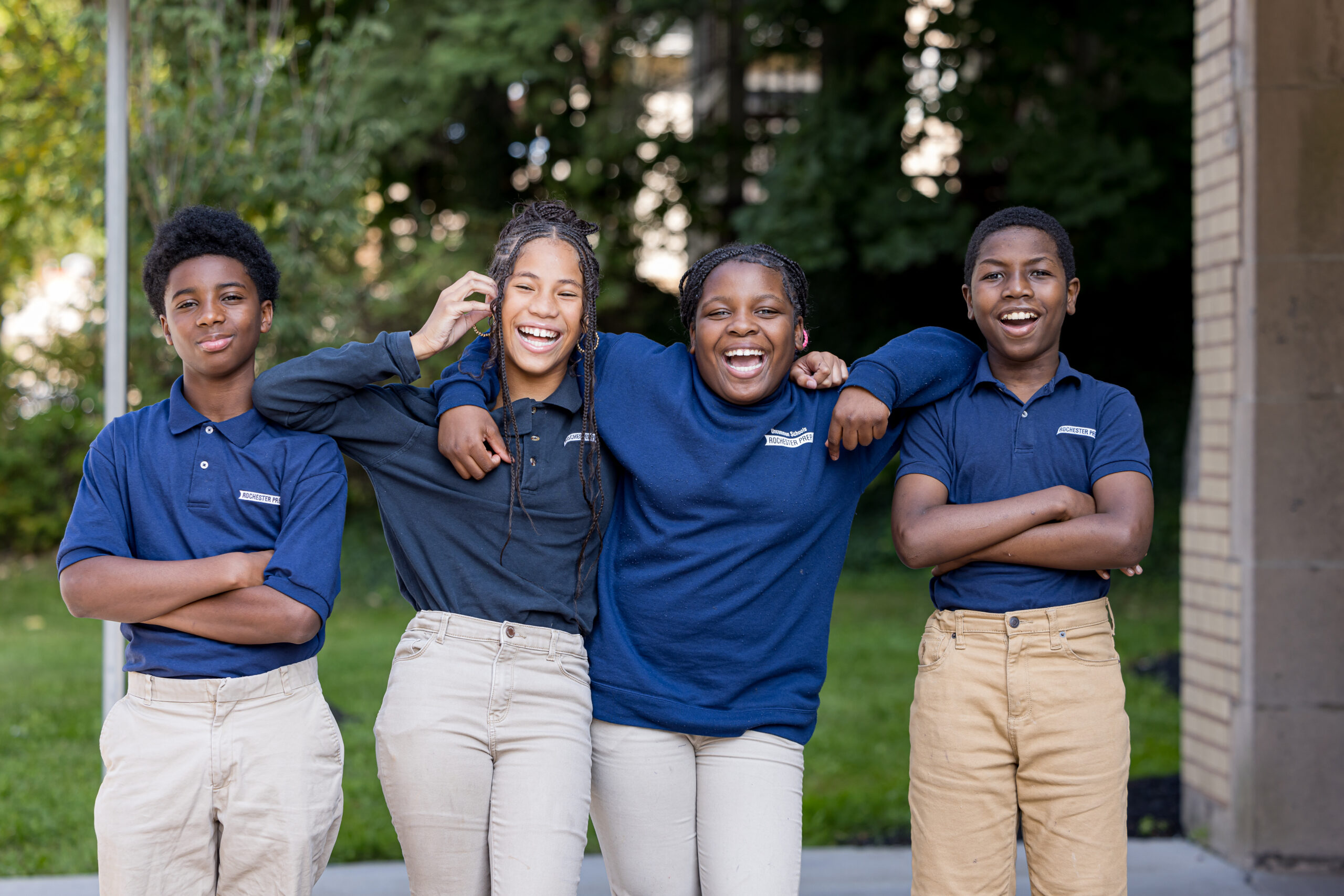 Middle school students smiling for the camera 